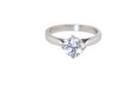 An impressive platinum solitaire ring set with a modern brilliant-cut white diamond.