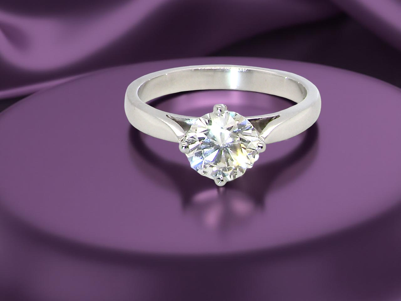 An impressive platinum solitaire ring set with a modern brilliant-cut white diamond. B