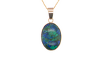 An interesting pendant set with an azurmalachite semi precious gem stone. Measures 20x15mm. Gold rim edged setting, with a V shaped bale. (tests as 9 carat gold)&nbsp;