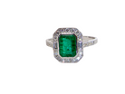 An&nbsp; Emerald and Diamond Cluster Ring – 18 carat White Gold
