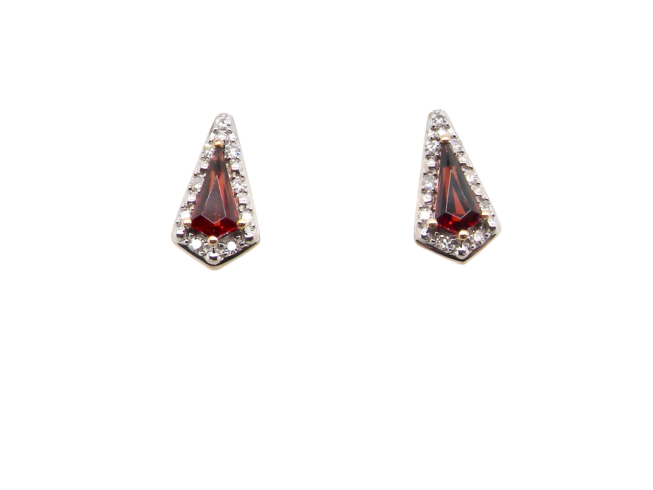 An unusual shaped pair of earrings. To the centre a kite shaped garnet 