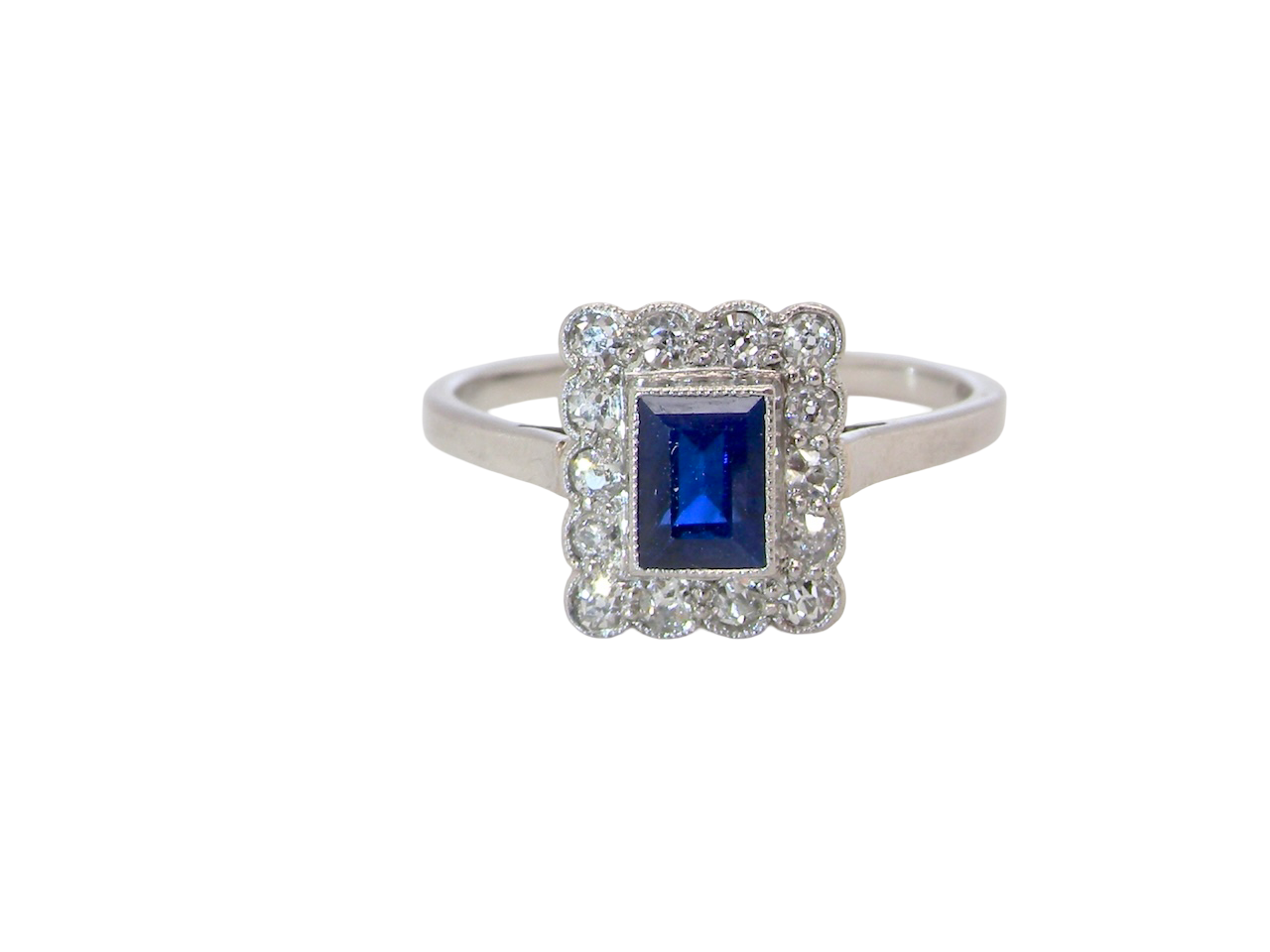  Art Deco cluster ring. Features a cobalt blue sapphire A