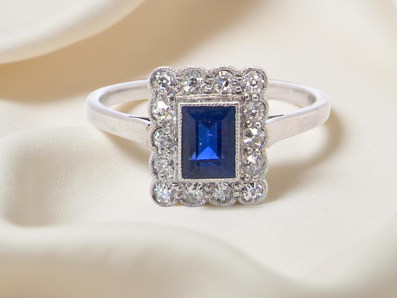  Art Deco cluster ring. Features a cobalt blue sapphire B