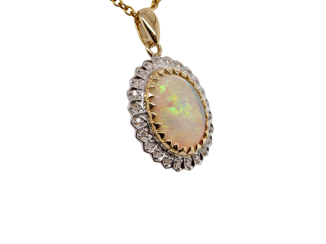 Opal pendant with diamond accents on a gold chain against a white background