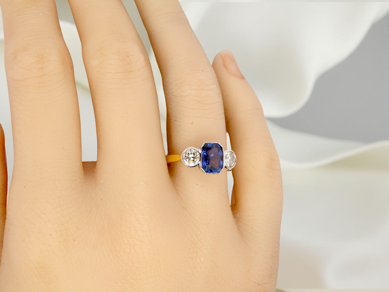 A three stone Sapphire and Diamond ring