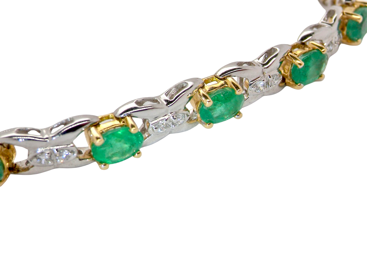 A white gold Emerald and Diamond bracelet