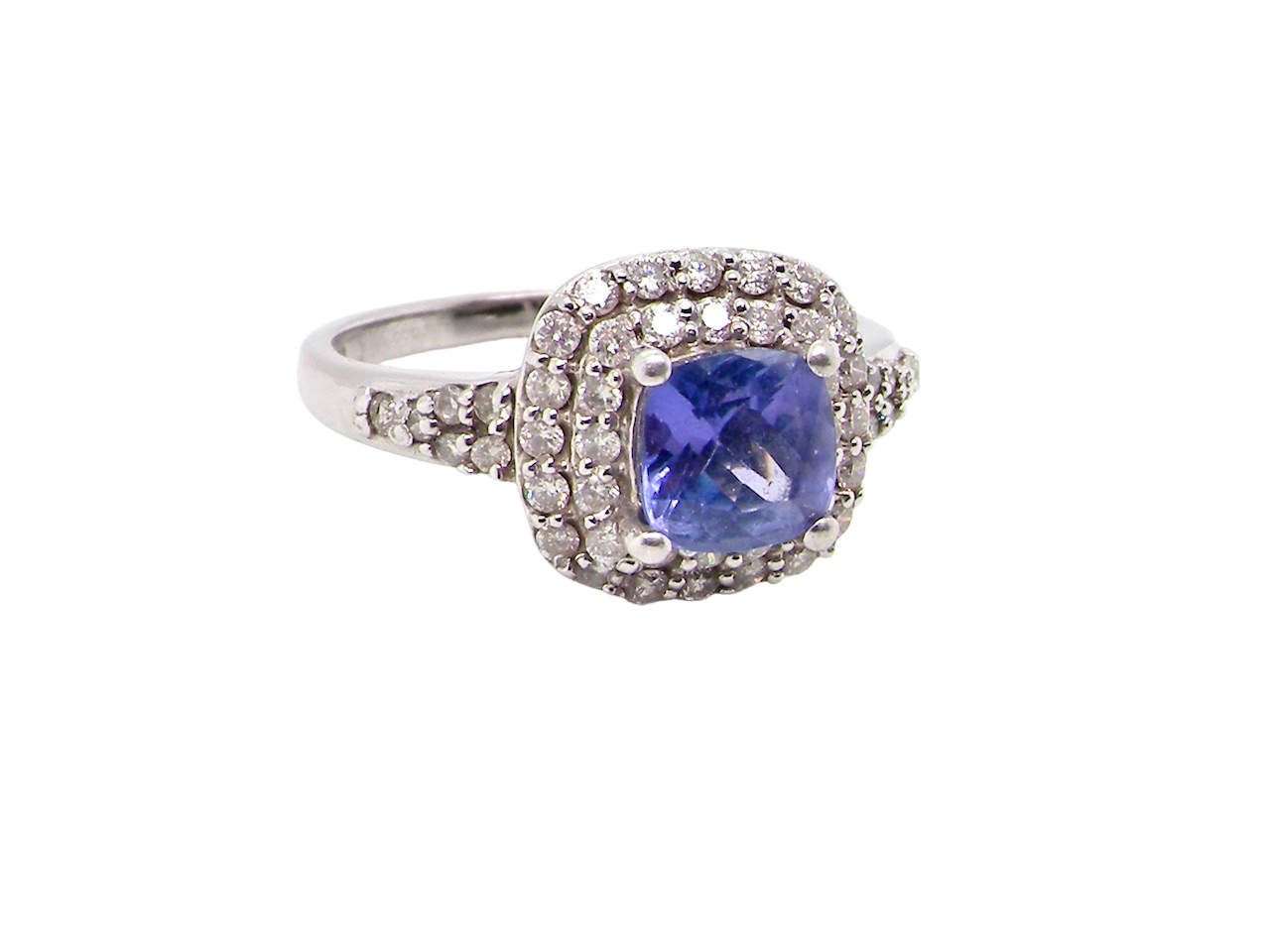 white gold tanzanite and diamond cluster ring