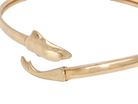 A gold dolphin bangle