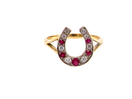 A ruby and diamond horseshoe ring