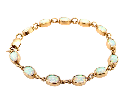 A  9 carat gold opal line bracelet