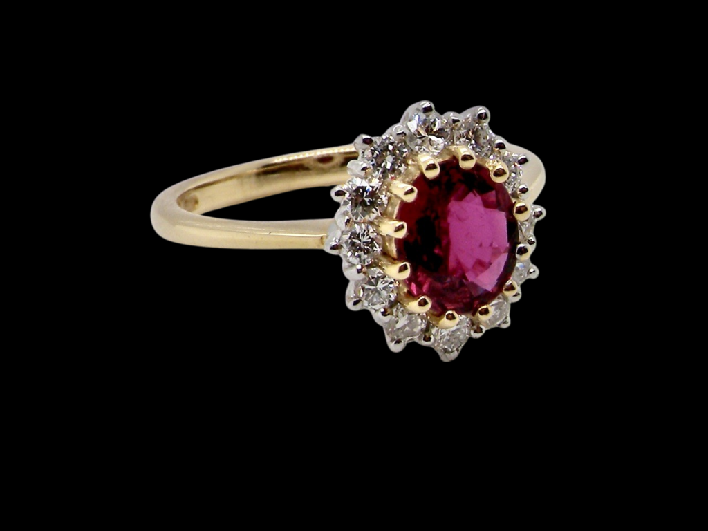 An 18 carat gold ruby and diamond cluster ring