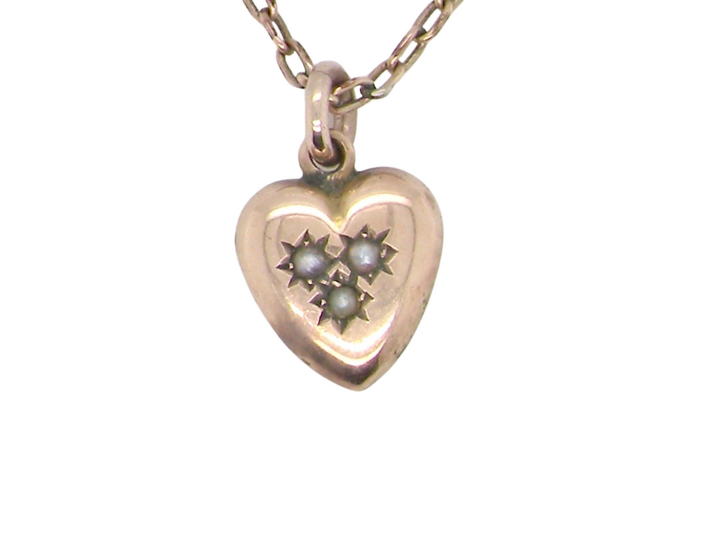 An antique heart shaped pendant