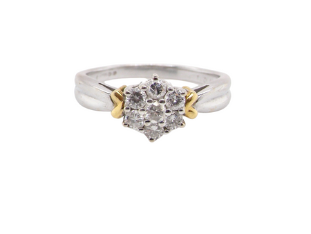 A white gold diamond cluster ring