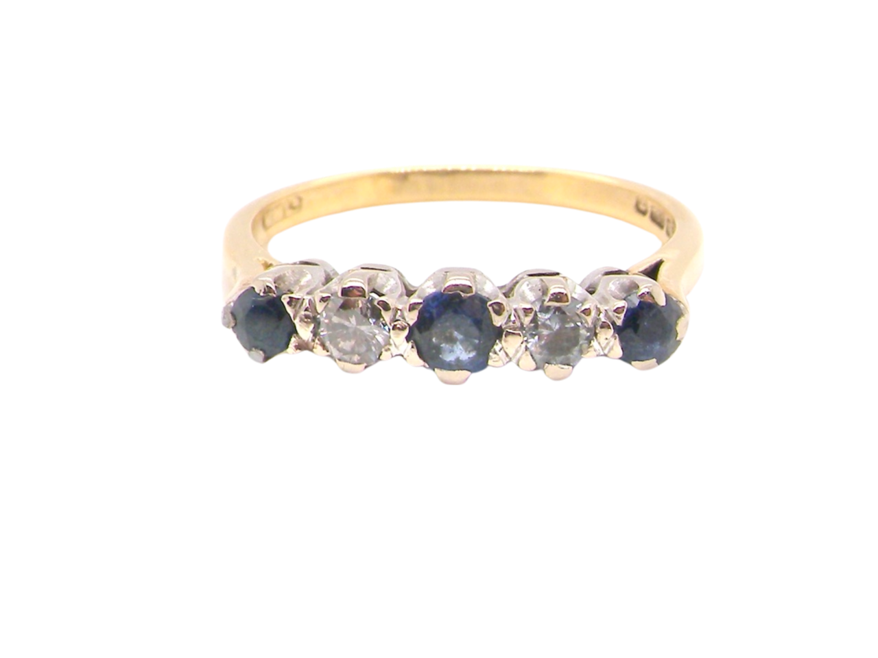 An 18 carat gold five stone sapphire and diamond ring