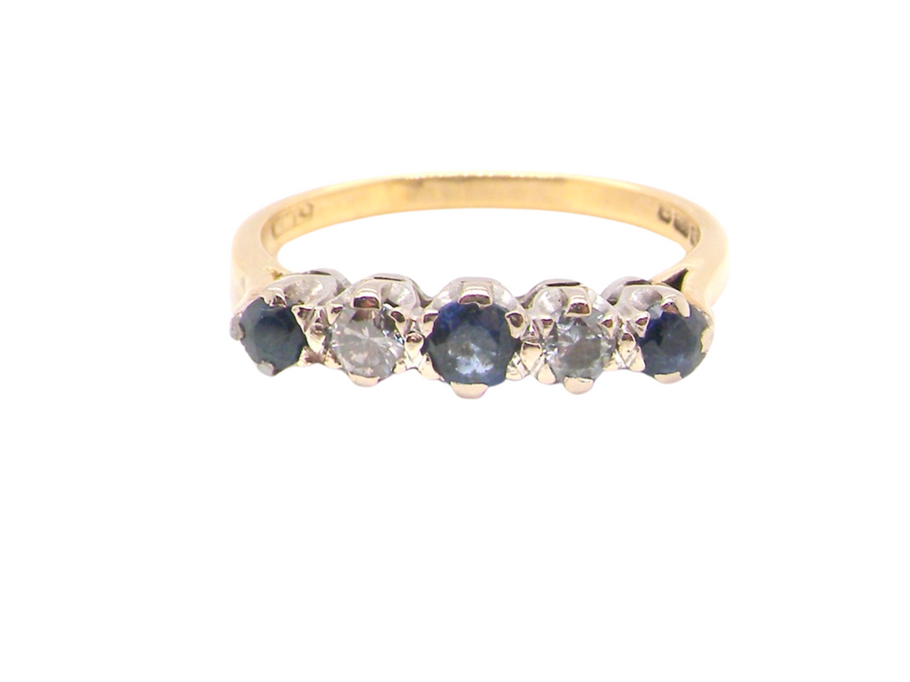 An 18 carat gold five stone sapphire and diamond ring