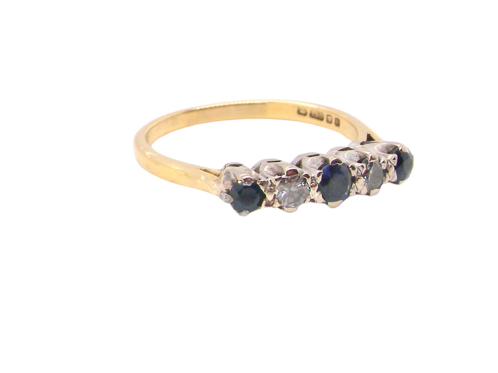 An 18 carat gold  sapphire and diamond ring