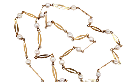 A yellow gold and cultured pearl necklace