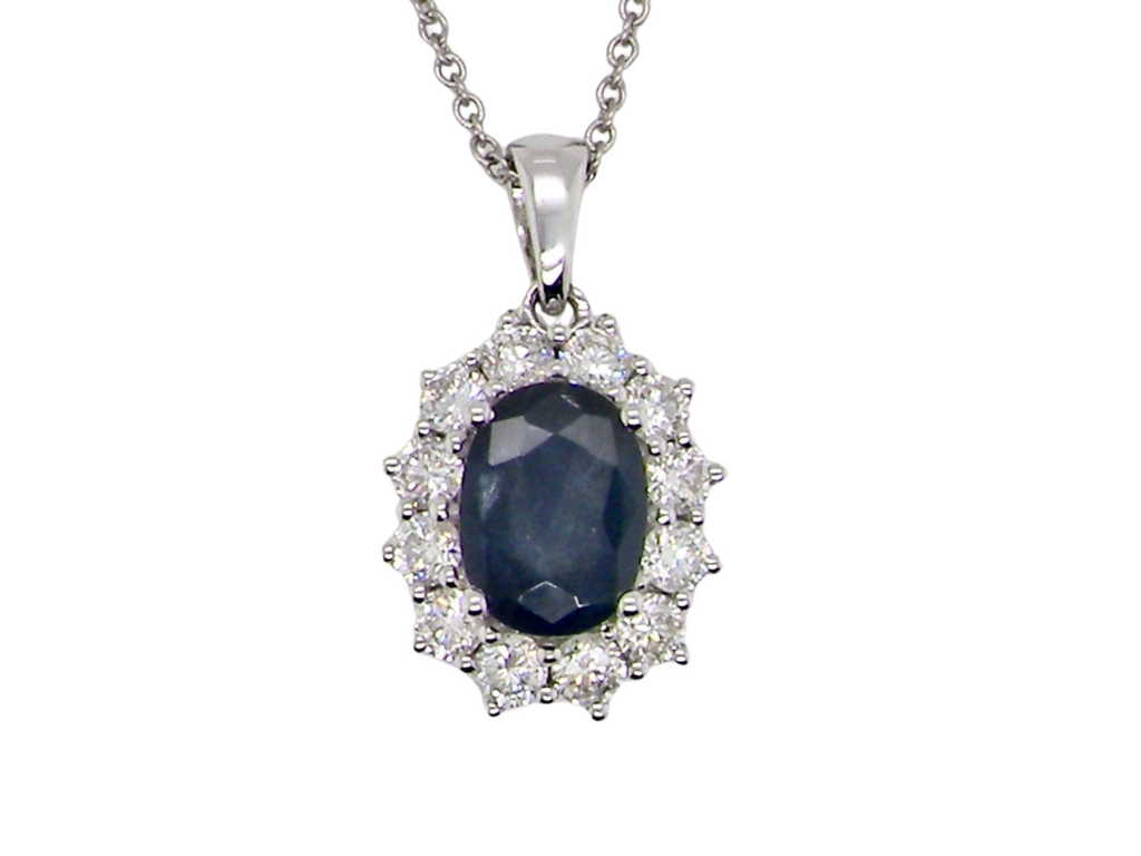 An 18 carat white gold sapphire and diamond pendant