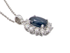 An 18 carat 18 carat white gold sapphire and diamond pendant