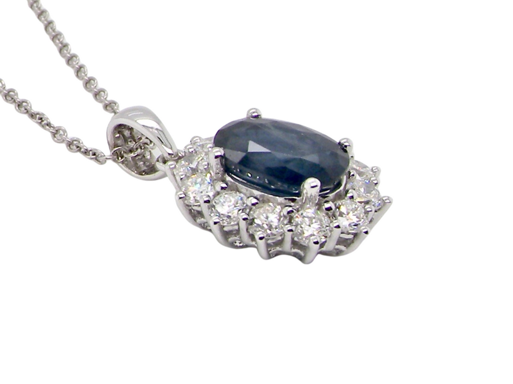 An 18 carat 18 carat white gold sapphire and diamond pendant