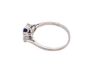 side  classic trilogy ring set with an exquisite oval cut sapphire centre stone, hues of deep&nbsp; blue colour and measuring 6x4.2mm (est approx 0.50 carats) 