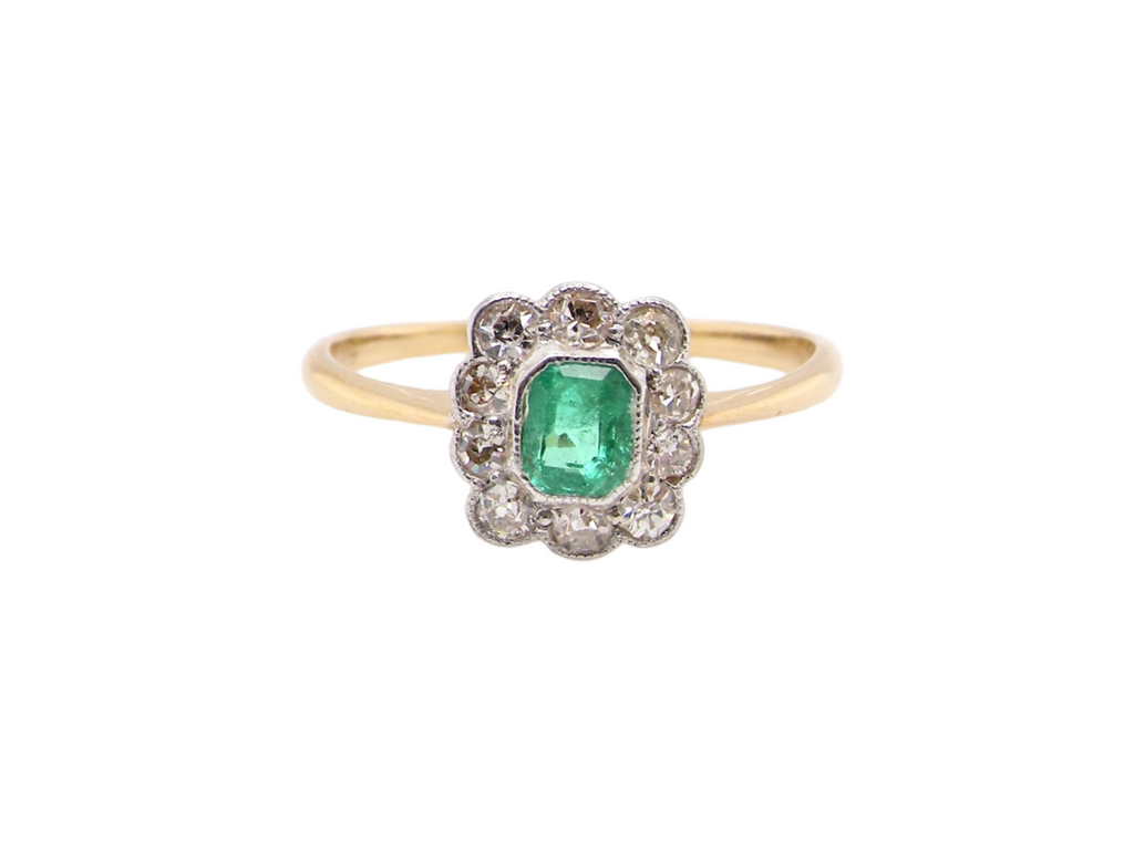A pretty vintage emerald and diamond ring