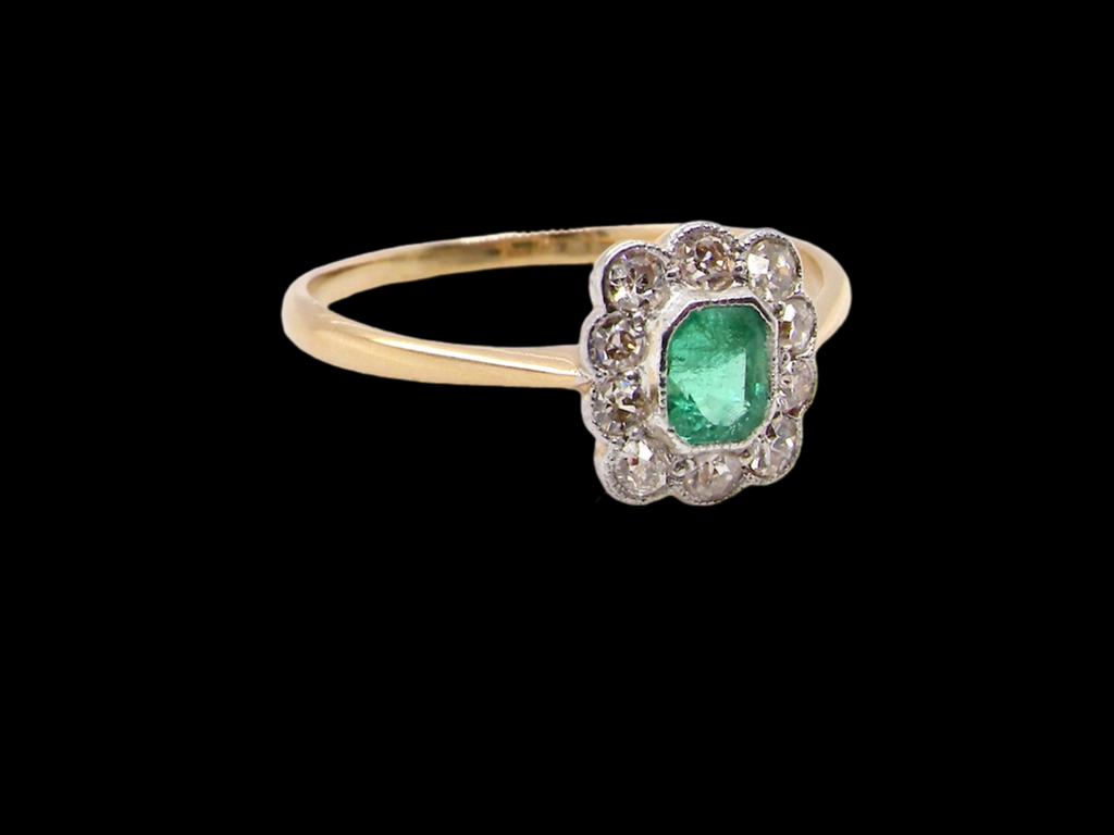 A  vintage emerald and diamond ring