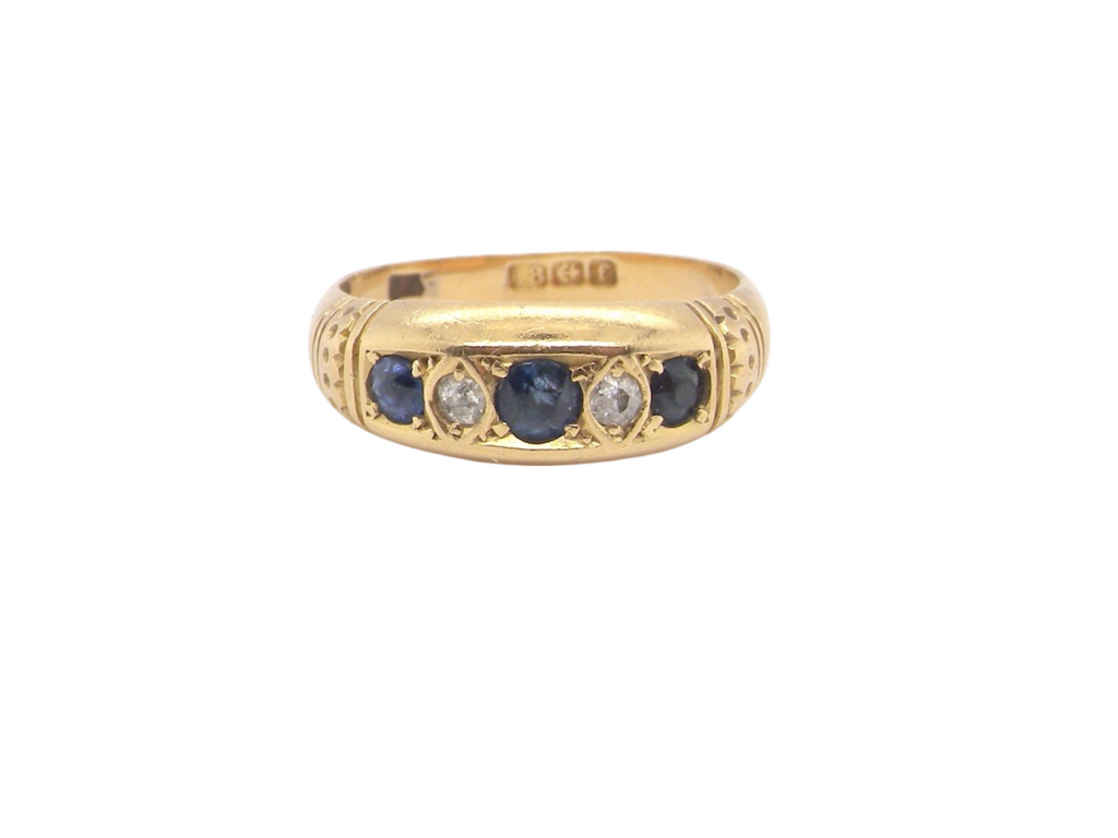 An 18 carat gold sapphire and diamond ring