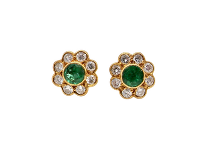 A pair of emerald and diamond earrings