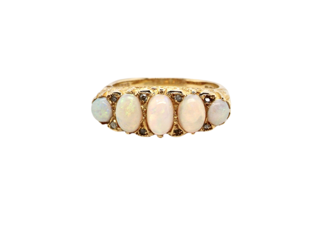 An 18 carat gold five stone opal ring