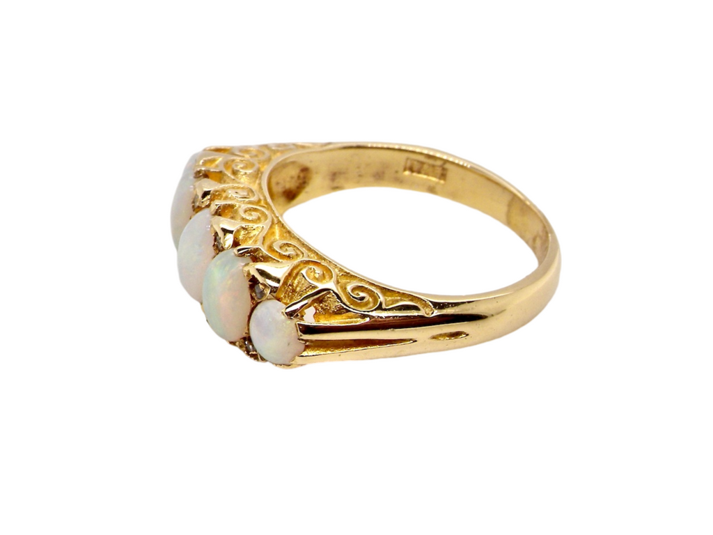 Side view- 18 carat gold five stone opal ring