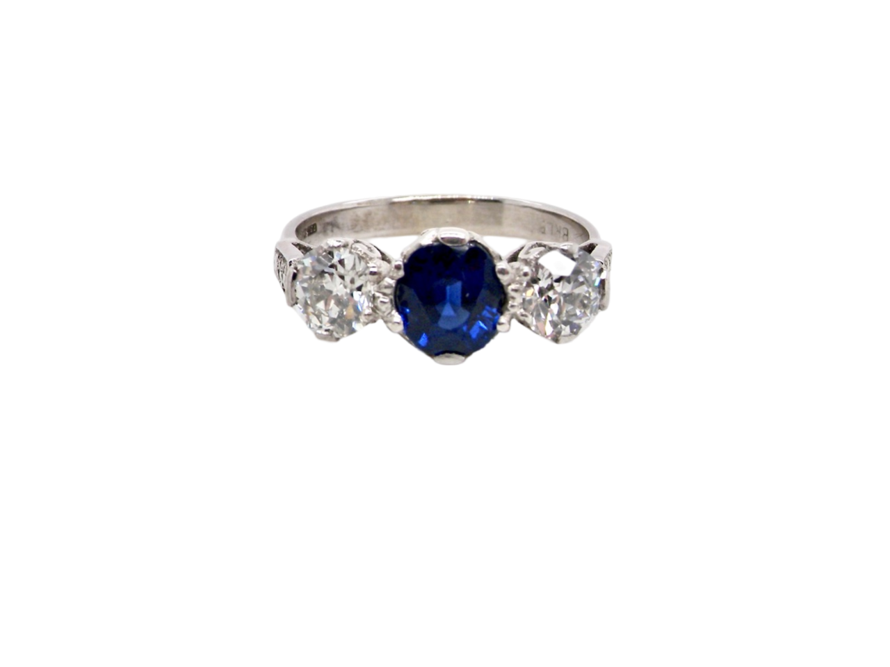 A fine three stone sapphire and diamond ring