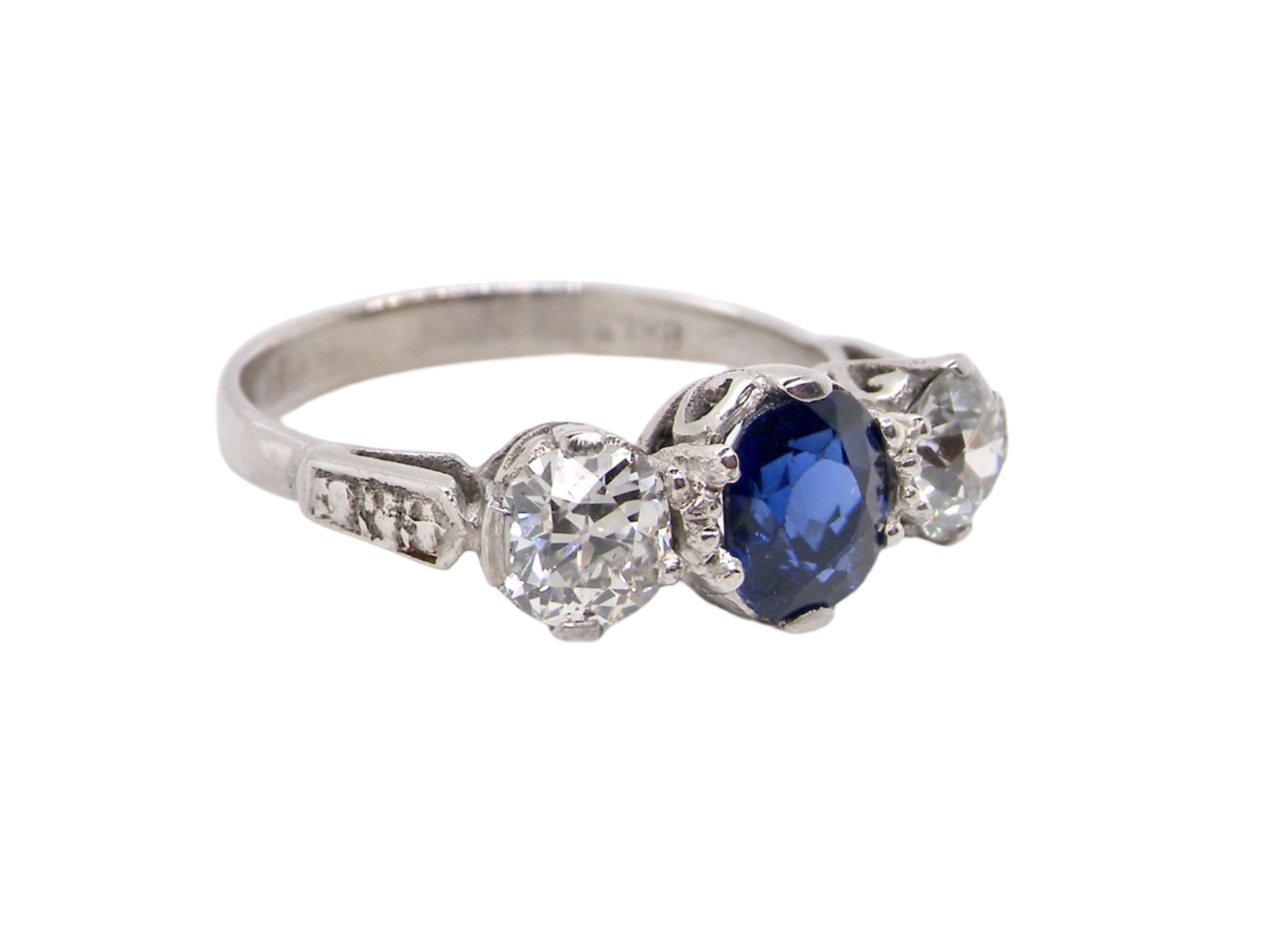 A 3 stone sapphire and diamond ring