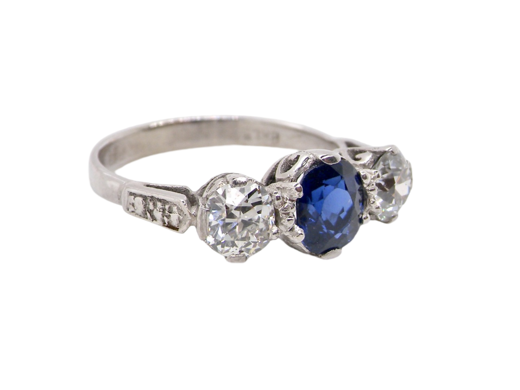 A 3 stone sapphire and diamond ring