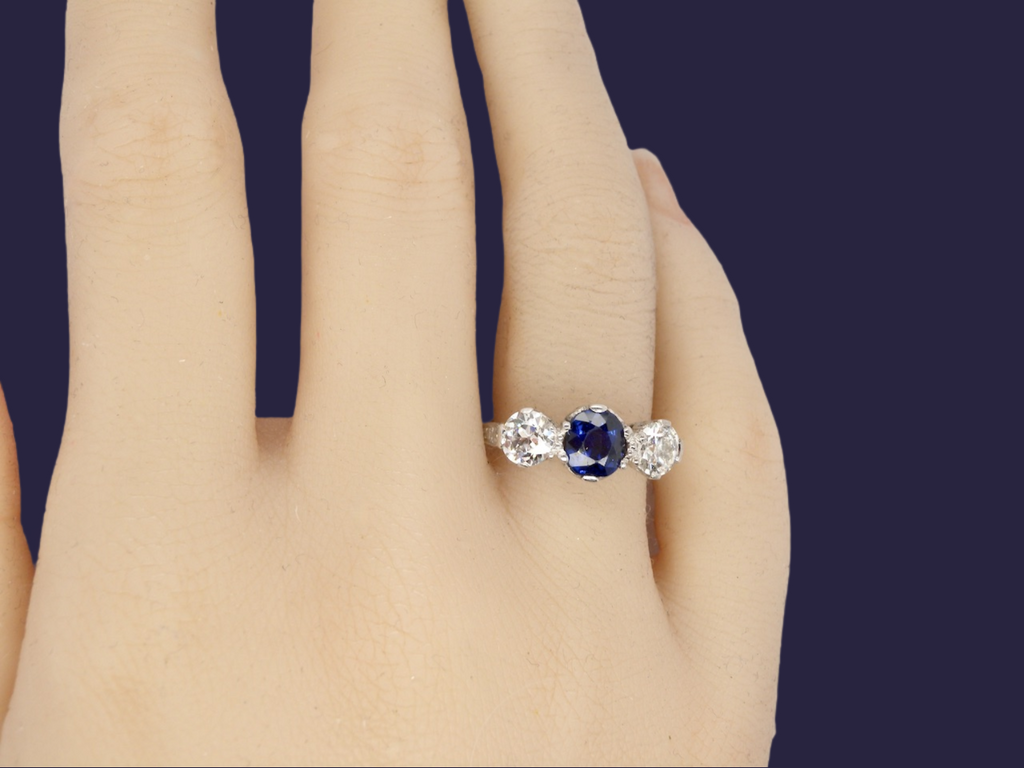 A vintage 3 stone sapphire and diamond ring