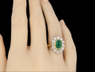 An 18 carat gold  Emerald and Diamond Ring