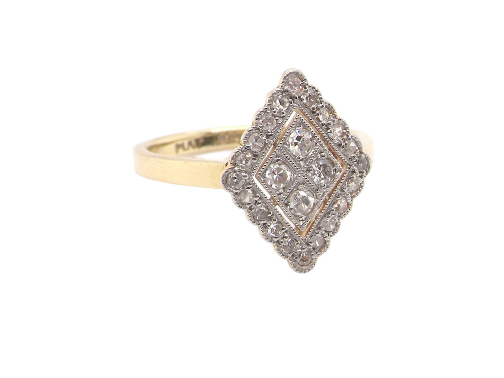 A navette shaped diamond cluster ring