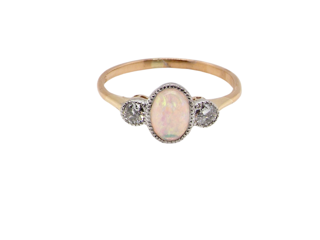 A vintage opal and diamond ring