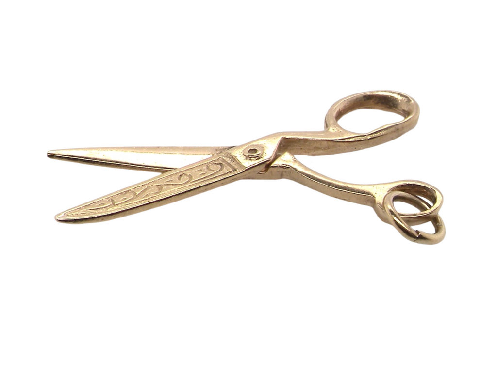 A 9 carat gold scissors charm
