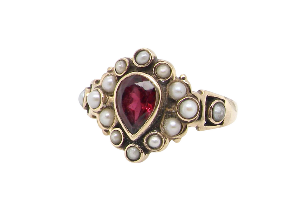 A vintage garnet and pearl dress ring