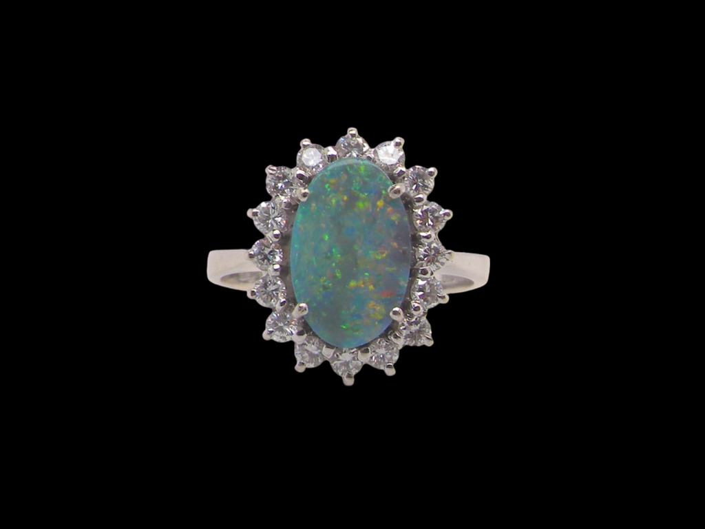 An opal and diamond ring