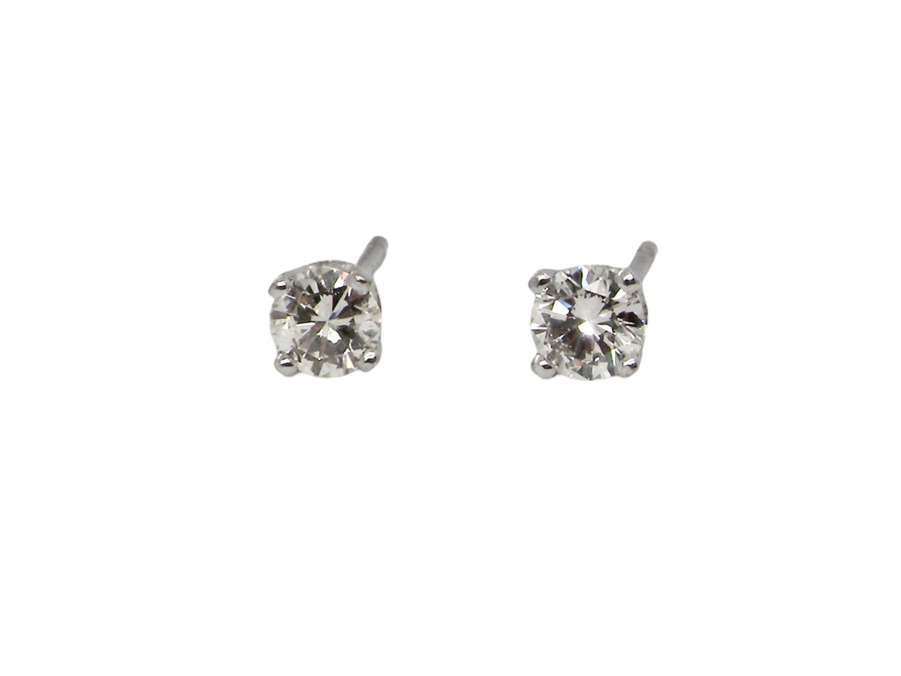 A pair of diamond stud earrings