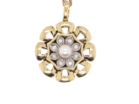 A fine pearl and diamond floral shaped pendant