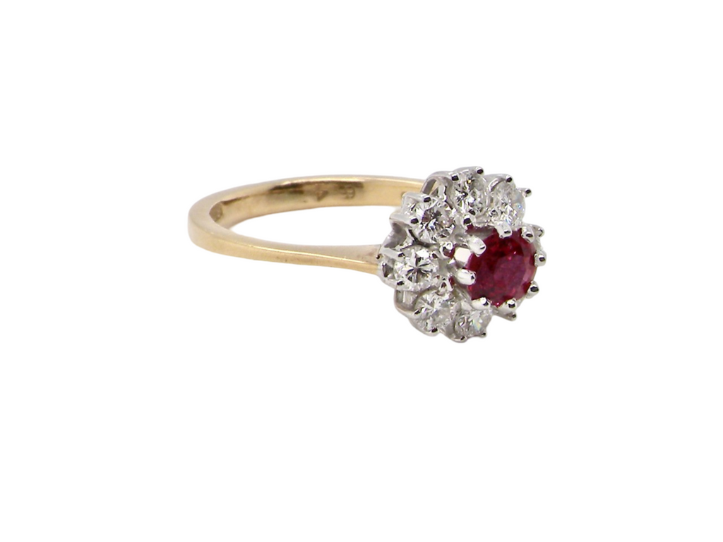 A ruby and diamond cluster ring side view