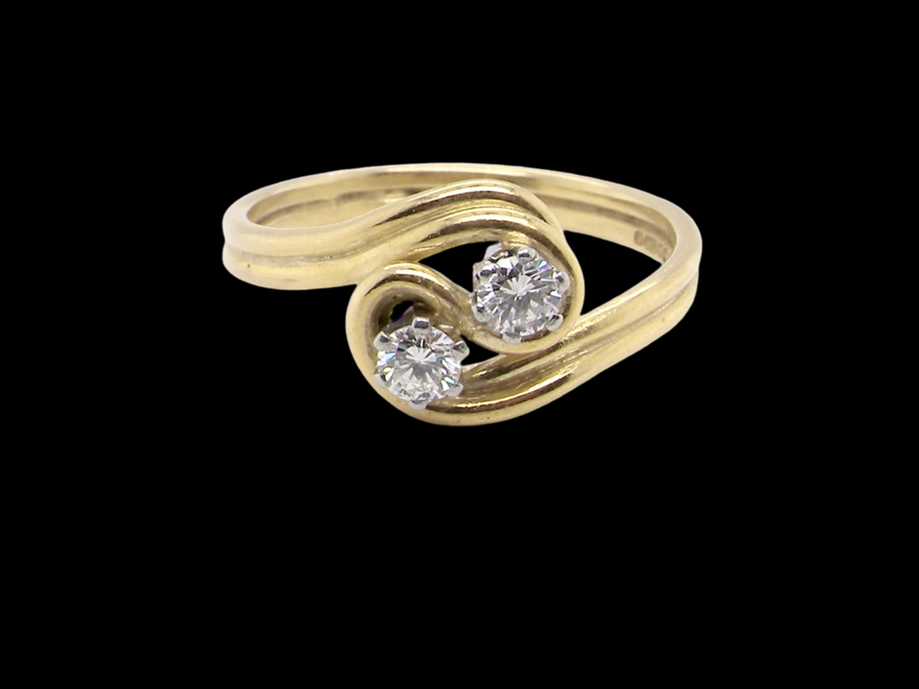 An 18 carat gold two stone diamond  ring