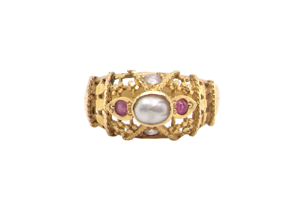 A high carat gold ruby and pearl dress ring