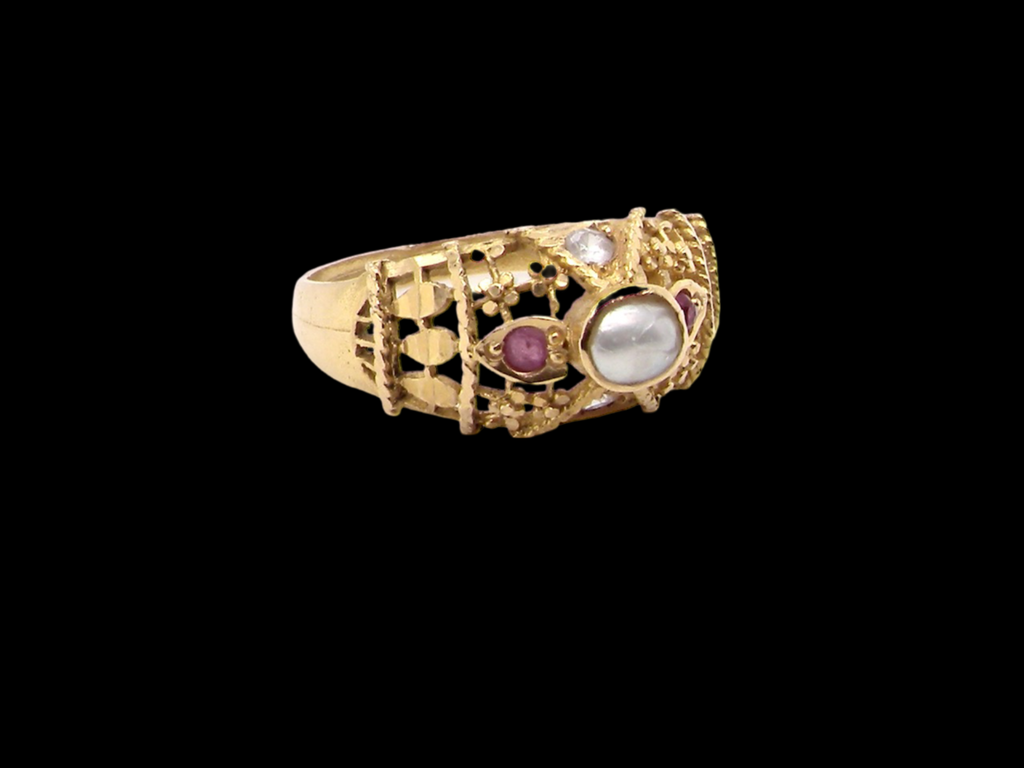 A high carat ruby and pearl dress ring