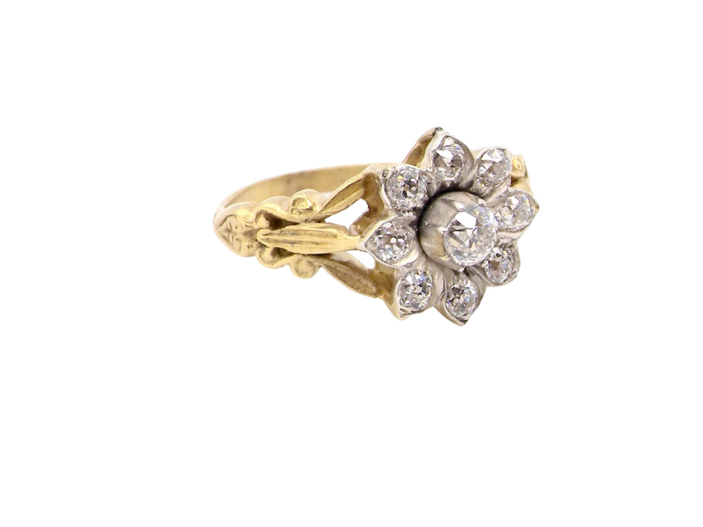 A vintage diamond cluster ring side view