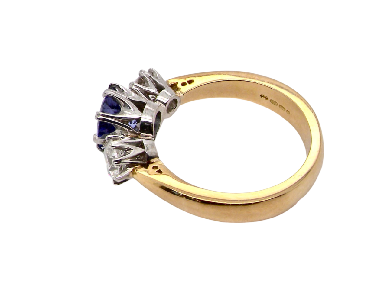 A three stone Tanzanite and Diamond Ring side view