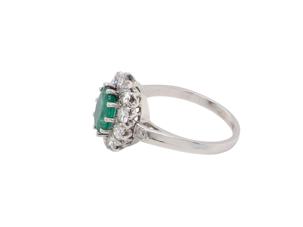 An Emerald and Diamond cluster ring side view